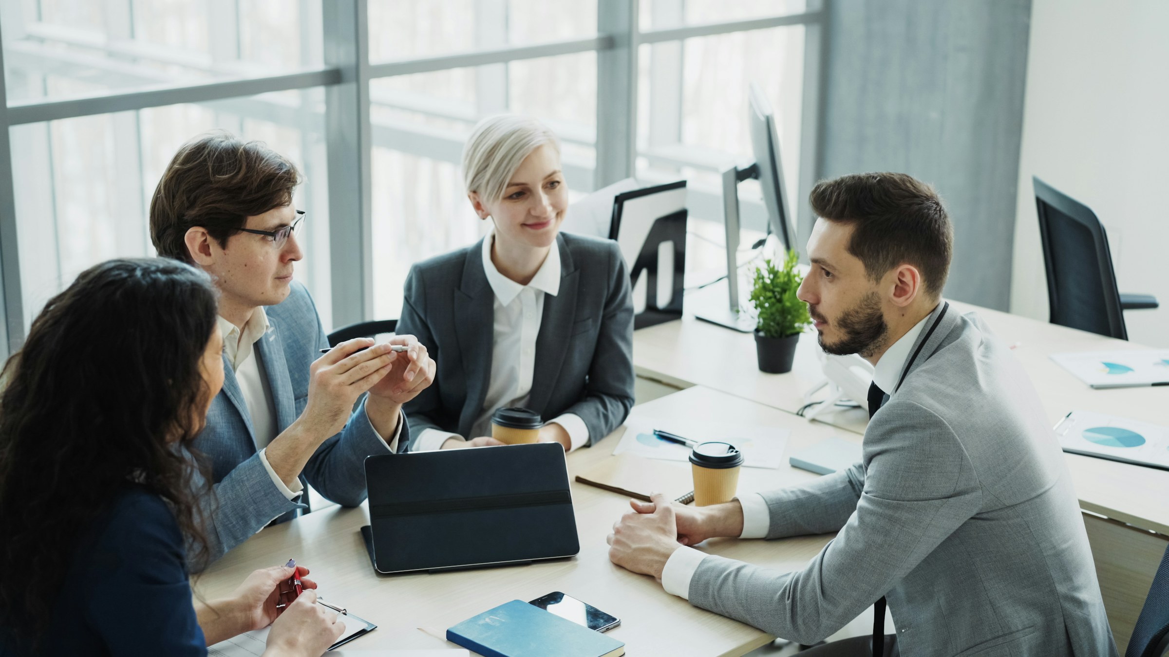 Professionals meeting to coordinate responsibilities